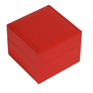 Close-up detail of a red PU leather square jewelry box, showing fine stitching and fine texture.