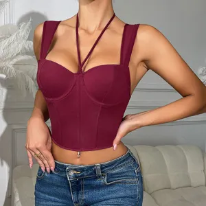 Close-up view of the burgundy corset crop top featuring fishbone support and stylish halter straps.
