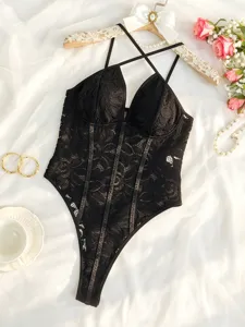 Black lace bodysuit with crisscross straps and floral embroidery details for sexy allure.