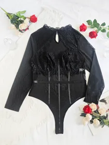 Detailed view of sexy black lace sheer long sleeve bodysuit featuring elegant cutout design.