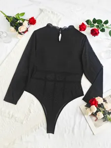 Sexy black sheer mesh long sleeve lace bodysuit detail view, elegant cutout design apparel.