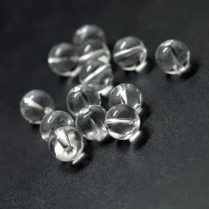 Close-up detail of clear acrylic round beads, perfect for DIY jewelry making and crafts.