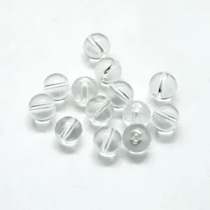 Detailed shot of transparent clear acrylic round loose beads with drilled holes for jewelry DIY crafting