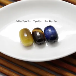 Natural tiger eye gemstone waist beads loose beads detail shot, smooth polished stone jewelry component.