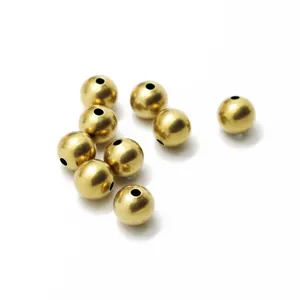 Smooth gold plated brass metal round spacer beads for jewelry making and DIY craft items.
