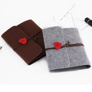 Felt DIY handmade photo album with cute heart button closure, retro memory book for gift.