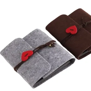 Felt DIY handmade scrapbook photo album with heart button closure for memories and gifts.