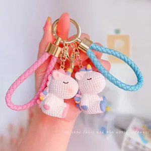 Llavero de unicornio de dibujos animados lindo con correa trenzada para bolsos y llaves.