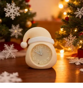 Detailed view of cute Christmas hat alarm clock, decorative desktop clock for kids room decor.
