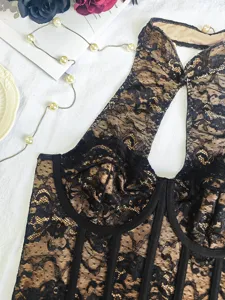 Sexy black lace boned corset top for women, featuring halter neck and chic nude lining style.