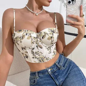Close-up detail of the floral print strapless bustier crop top, showing the corset boning design.
