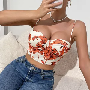 Detailed view of the floral print corset crop top featuring structural boning and slim spaghetti straps.