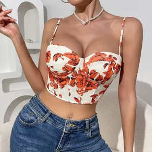 Detailed view of the vintage orange floral corset top with slim straps and fitted bustier.