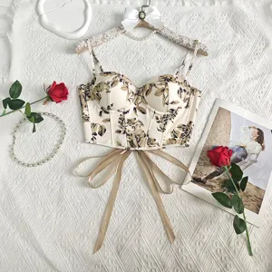 Vintage floral print corset top with boning, delicate straps and bow tie waist detail.