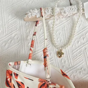 Vintage floral camisole top detail view showing adjustable straps and chic design elements