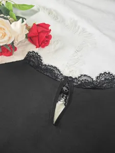 Black lace trim top detail with keyhole cutout and button closure, elegant flat lay design view.