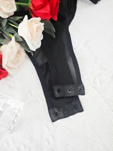 Black mesh bodysuit crotch detail, sheer fabric with convenient metal snap buttons.
