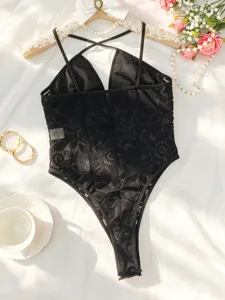 Sexy black lace backless bodysuit detail, elegant floral pattern and delicate straps design.