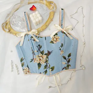 Top corsé floral vintage francés con elegantes lazos y diseño ajustado en detalle.