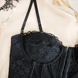Black lace bustier detail view, featuring underwire support and delicate floral lace design.