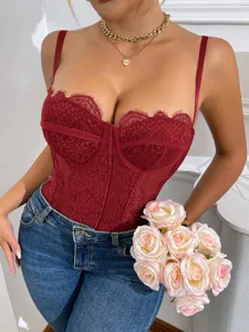 Close-up view of the sexy red lace bustier trim detail, highlighting textured mesh and fine stitching.