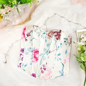 Close-up detail of floral print corset top with structured fishbone design on soft fabric.