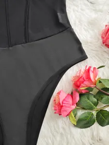 Black mesh bodysuit detail, sexy sheer shapewear close-up, premium underwire fabric design.