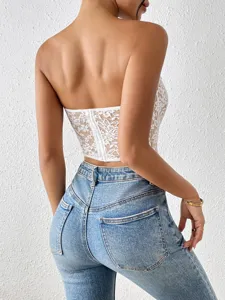 White lace strapless crop top for women, sexy backless bustier worn with blue denim jeans.