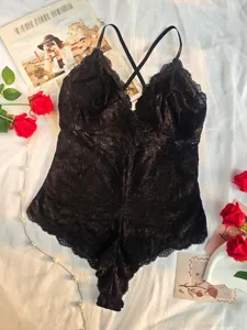 Sexy black lace bodysuit for women featuring cross back straps and floral details for nightwear.