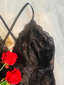 Black lace sexy bodysuit detail, backless spaghetti strap lingerie for women fashion appeal.
