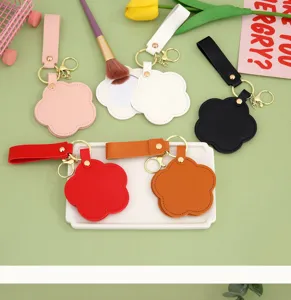 Creative minimalist flower mirror keychain PU leather round mirror key strap portable bag accessory.