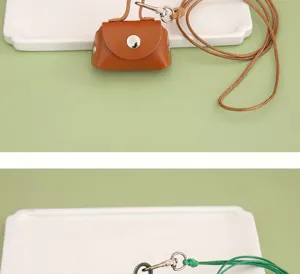 Mini PU lederen oortelefoon opbergtas en lanyard detailweergave, compact en handig.