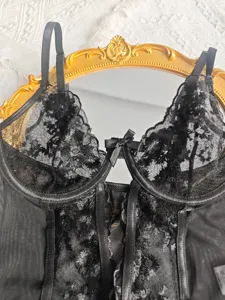 Black lace bodysuit detail, sheer mesh texture, adjustable straps, boned shaping corset.