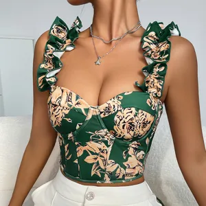 Green floral print bustier top with ruffles and boning, stylish summer detail view.