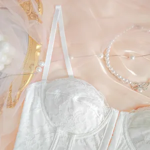 Detailed close-up of white lace bustier top, intricate floral lace and boning texture.