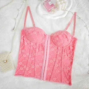 Detailed view of pink lace corset bustier top featuring underwire and front button closure.