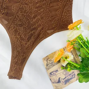 Detail shot of brown lace sheer bodysuit featuring floral lace patchwork and delicate straps.