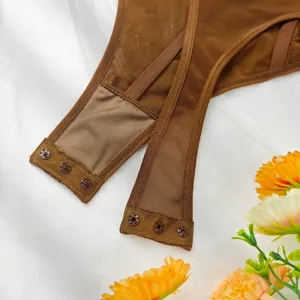 Brown lace mesh bodysuit detail featuring sheer fabric and snap buttons for women