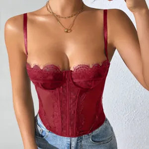 Red lace corset detail shot showcasing sheer fishbone bodice and adjustable slim straps.