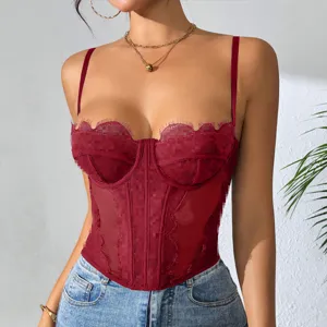 Close-up detail view of the red lace corset top with sheer mesh and delicate trim.