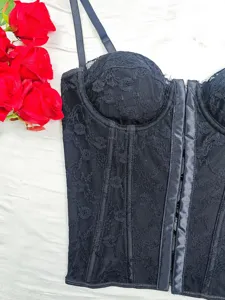 Black lace corset top with floral jacquard, slim straps, and front hook closure for stylish wear.