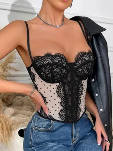 Close-up view of the black lace corset top featuring sheer polka dot mesh and delicate details.