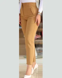 Casual high-waisted slim-fit cropped trousers detail shot, camel color workplace pants.