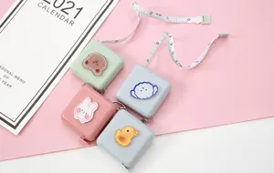 Mini cinta métrica retráctil de dibujos animados linda y portátil para medir la cintura corporal.