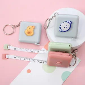 Mini cinta métrica retráctil portátil con lindo colgante de dibujos animados y llavero útil.