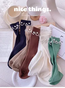 Pearl embellished knit mid-calf socks detail shot showing texture and elegant style.