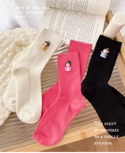 Women's cute vertical striped mid tube socks with sweet cartoon character accessories.
