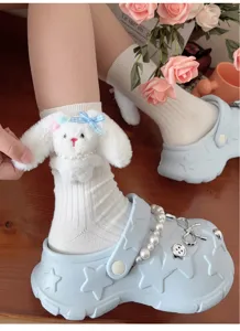 Cute plush rabbit ear cotton mid-tube socks with bow detail, sweet style detail shot.