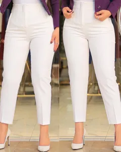 Detail shot of women's high-waisted slim fit cropped suit pants in crisp white color style.