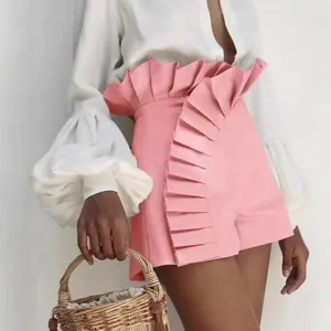 Stylish women high waisted pink shorts featuring a unique dramatic pleated ruffle front design.